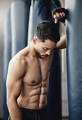 Image showing Boxing training, tired workout and boxer with strong body during cardio exercise, muscle power from sports and professional fight competition. Health athlete in gym for wellness and motivation