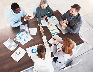 Image showing Business handshake, partnership and contract agreement of corporate clients in a meeting room. Crm, b2b and welcome or thank you hand sign of company deal in a marketing presentation with paper data