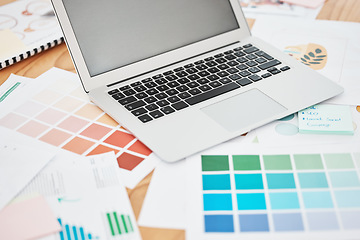 Image showing Creative color swatch, laptop planning and paperwork for designer, marketing and advertising strategy on office desk. Background creativity project, art documents and paint catalog for online graphic