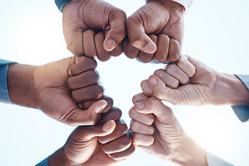 Image showing Diversity, fist bump and success of a corporate team collaboration winning a company business deal. Group, celebration and hands in unity at a business meeting for motivation and achievement.