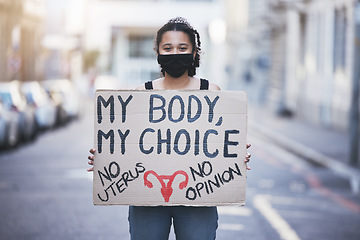 Image showing Protest woman, abortion choice or healthcare cardboard poster in a city street for body, human rights and law politics. Girl voice, opinion or slogan words for gender equality with face mask portrait