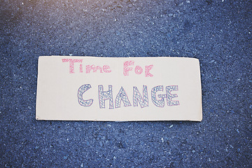 Image showing Climate change, poster or billboard banner on protest cardboard sign for planet earth, world sustainability or globe security. Abstract zoom on future global warming or eco environment on city street