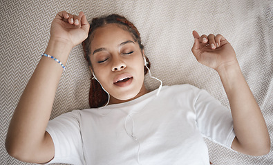 Image showing Relax, sleep and bed with woman listening to music while sleeping in her bedroom from above. Radio, podcast and meditation frequency sounds with female using relaxation streaming to help relaxation