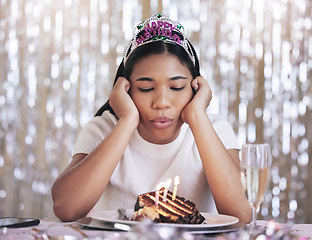 Image showing Depression, birthday, and teenager bored at birthday celebration, isolated by covid and dull cake. Compliance, lockdown and sad female blow candles alone, feeling depressed and lonely during corona