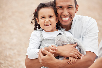 Image showing Happy family at beach, father gives kid a hug with smile on her face and laughing with dad. A summer getaway, traveling the world on vacation with family and holidays with friends is a great a break