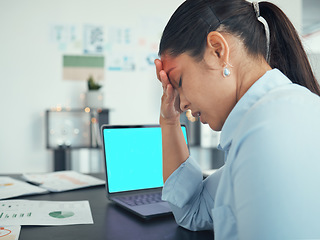 Image showing Anxiety, stress and laptop screen with green screen and mockup in a office at a company desk. Business woman with burnout, headache and mental health problem with work depression or sad in office