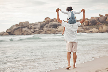 Image showing Family, beach and child on shoulder of dad for support on summer holiday, happiness and lifestyle. Freedom, vacation and care with father holding daughter and walking by the sea for love and joy