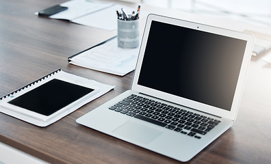 Image showing Office, laptop and screen on a desk with computer and notebook for new recruit. Table, stationery and an organized setup for productivity at work. Ready to start a new business project at startup