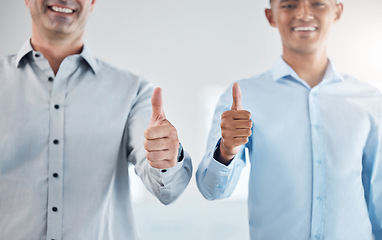 Image showing Thumbs up, thank you and motivation with a business man and colleague saying yes in studio on a gray background. Winner, goal and success with a male employee and coworker in agreement with a smile