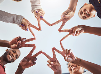 Image showing Friends doing a star with hands, with synergy as a team at a team building event and being outdoors in the sun. Business success means productive staff, showing unity and using collaboration