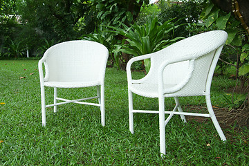 Image showing Two white chairs