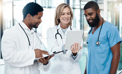 Image showing Doctors, meeting and tablet for healthcare planning using information technology for medical development, talking about medicine. Healthcare team consulting about strategy and innovation in hospital