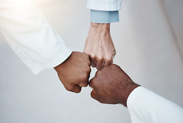 Image showing Trust, teamwork and hand fist together in solidarity with medical ethics in the workplace. Support of diverse professional healthcare work people in organization with respect and loyalty.