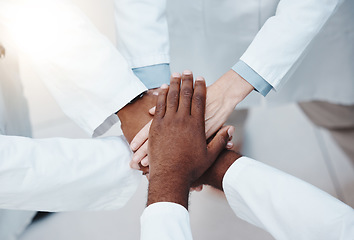 Image showing Collaboration, motivation and support with hands of doctors from top view, working in healthcare, vision and innovation. Diversity, teamwork and goals with group of medical professionals for trust