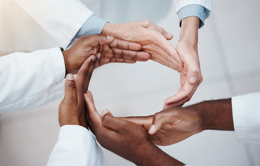 Image showing Healthcare, teamwork and doctors hands in a circle for support, trust and diversity. Connection, collaboration and partnership in medicine. Success, hope and unity, group of medical workers together.