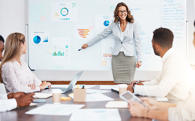 Image showing Business manager doing a corporate presentation to a team in the company conference room. Business meeting with graphs, charts and data paperwork for planning a management strategy on a project.