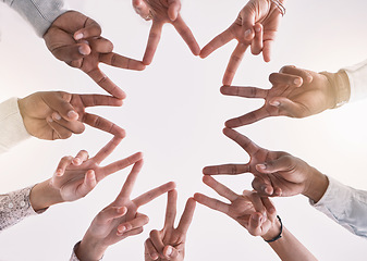 Image showing Peace sign, support and unity with business people in teamwork, collaboration and global company. Zoom on hands, diversity men and women in star gesture for trust, motivation goal or office community