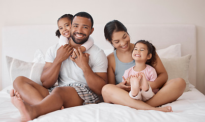 Image showing Portrait, happy and family in bed with smile, hug and love while relax in the morning. Parents bonding with their children in the bedroom with happiness, care and healthy relationship in home