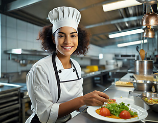 Image showing female chef in a commercial kitchen 