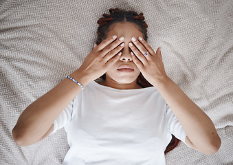 Image showing Stress, anxiety and black woman using hands over eyes to calm, relax and peace in bed. Stress management, mental health and insomnia with sleepless young female lying in bedroom for depression