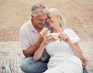 Image showing Love, picnic and elderly couple on a romantic date outdoors, celebrating retirement and freedom in a park together. Relax, food and nature with happy man and woman embrace, bonding with affection