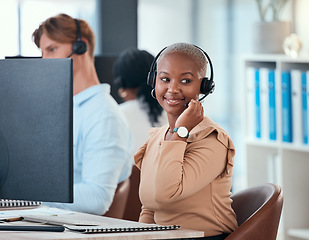 Image showing Black woman working in call center, customer service or online help desk office on conversation with client or customer. Communication, consulting and telemarketing consultant giving a sales pitch