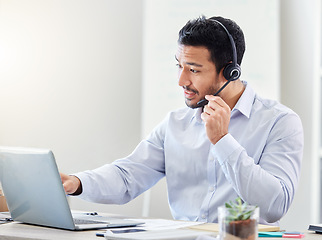 Image showing Asian call center man, telemarketing and CRM consultation with customer service, contact us and support in office. Consultant, businessman and employee working with consulting, help and IT support.