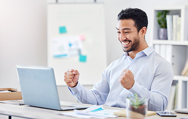 Image showing Motivation, success and yes with a business man in celebration and working on a laptop by his desk in the office. Email, good news and smile with a young and happy male employee cheering at work