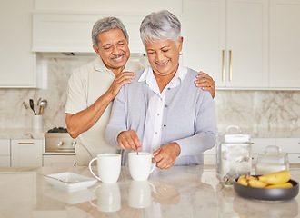 Image showing Coffee, couple and love with a senior woman and man enjoying retirement while together in the kitchen of their home. Happy, smile and romance with an elderly male and female pensioner making tea