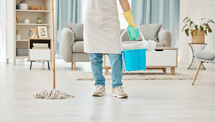 Image showing Cleaning, mop and spring cleaning equipment with woman in living room for domestic, hygiene and sanitary. Maid or housekeeper with container in home for interior, house or apartment cleaning service