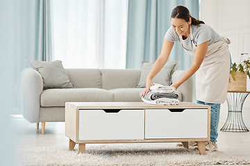 Image showing Asian cleaner or woman with towel laundry happy working for luxury hospitality hotel, home or house cleaning service agency. Japanese girl maid, employee or worker smile and help at rich apartment