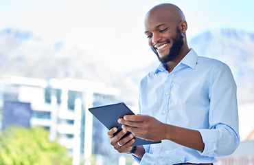 Image showing Businessman with digital tablet and happy with business progress, profit and growth while alone on office balcony. Male smile corporate executive using technology to plan success or innovate idea