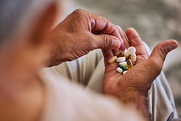 Image showing Pills, medicine and healthcare of senior man taking daily capsules for chronic illness, cancer or health. Wellness, medication and sick elderl with medical drugs, vitamins or supplements in his hand