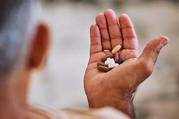 Image showing Senior hand of man with pills, medicine or medication for disease, cancer or health at home. Wellness, healthcare or sick elderly retired person with medical drugs, aspirin or antibiotics in palm.