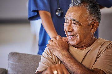 Image showing Nurse or doctor give man support during recovery or loss. Caregiver holding hand of her sad senior patient and showing kindness while doing a checkup at a retirement, old age home or hospital