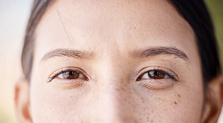 Image showing Woman, freckles and portrait of natural eyes closeup with thinking and idea facial expression. Young girl with bare face, beauty and healthy skin spots and brown iris for skincare campaign.