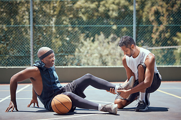 Image showing Injury, physiotherapist and basketball player with help support during sports game, first aid help on court and emergency during training. Athlete with muscle pain and medical coach after accident