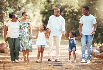 Image showing Black big family, love and a walk in nature, outdoors or outside on holiday, vacation or trip. African ancestry, grandmother or children with mother, fathers or siblings together walking at the park