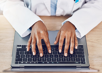 Image showing Hands, woman and doctor with laptop working at a desk in a hospital office. Medical expert with wireless technology to diagnose or research diseases in the field of health and medicine online or web