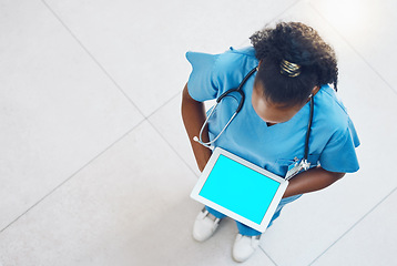 Image showing Tablet, green screen and doctor or nurse for hospital app advertising, online software marketing or telehealth clinic management. Black woman healthcare worker on digital IT technology mock up above