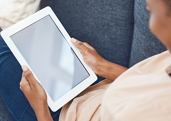 Image showing Mockup digital tablet, in hands of black woman on couch in a living room in her house and goes online to find entertainment. Mobile technology is used for social media, e-commerce and video call