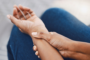 Image showing Hands, arm injury or pain of black woman after working hard in home or house interior. Hand, health and wellness of African female injured wrist after work on pc computer, carpal tunnel or arthritis.