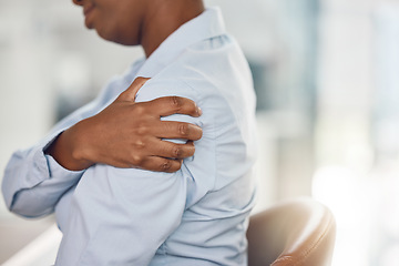 Image showing Black woman, shoulder pain and office injury from stress, burnout and target pressure. Zoom on hand, business worker or employee worried about muscle pressure from furniture chair and working posture