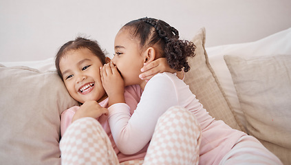 Image showing Girl, friends or children whisper secret to best friend on home sofa while relax together on play date. Communication, conversation and sisters or youth kids gossip at fun slumber party or sleepover