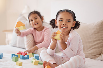 Image showing Kids, building blocks and play learning for fun, education and healthy development in bedroom at home. Portrait of two excited children, friends and young girls building with creative toys and games