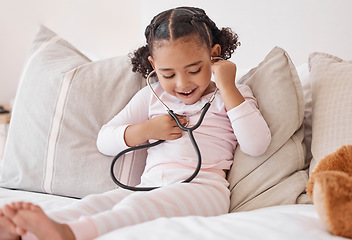 Image showing Happy girl, doctor stethoscope and listening to heartbeat sound with excited smile at play learning. Young and curious child with healthcare exam equipment smiling with joy in home bedroom.