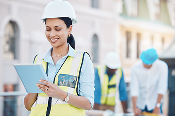 Image showing Construction, building and tablet with a woman architect working in the city on a build site with her team in the background. Engineer, designer and architecture with a young female at work online
