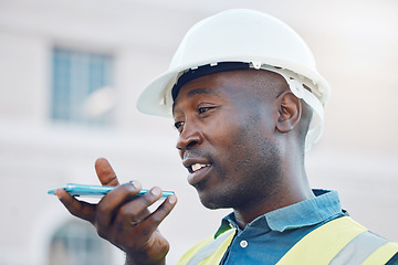 Image showing Communication, safety and a construction worker on phone call or sending voice note. A black man, engineer or builder on mobile at building site. Contractor working and talking on smartphone outdoors