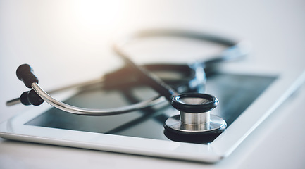 Image showing Stethoscope, digital tablet and telehealth app on hospital, medical wellness and healthcare table. Zoom on communication internet technology, medicine equipment support and insurance consulting help