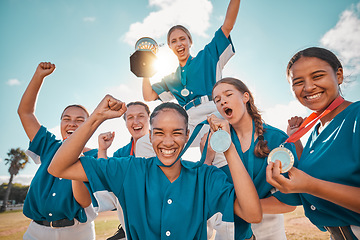 Image showing Women, winner and baseball team winning a trophy award medals after a successful match game together. Smile, teamwork and happy girls on field in celebration of a reward prize in a sports tournament